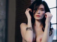 Exotic natural busty models posed in front of a camera